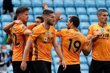 Wolverhampton Wanderers' Leander Dendoncker, left, celebrates after scoring the opening goal during the match against Aston Villa. AP