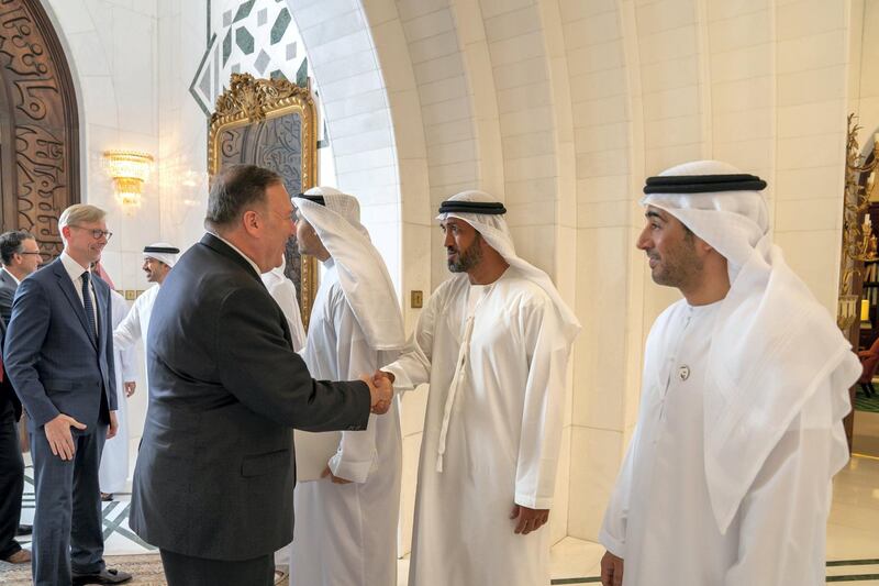 ABU DHABI, UNITED ARAB EMIRATES - September 19, 2019: HE Mohamed Mubarak Al Mazrouei, Undersecretary of the Crown Prince Court of Abu Dhabi (2nd R), greets Michael R Pompeo, Secretary of State of the United States of America (L), prior to a meeting the Sea Palace. Seen with HE Ali Saeed Al Neyadi (R). 

( Mohamed Al Hammadi / Ministry of Presidential Affairs )
---