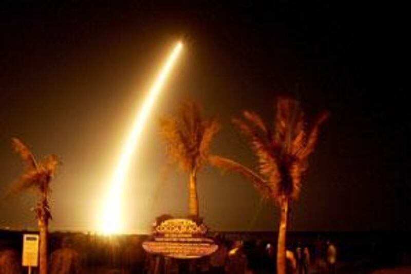 Spectators watch the launch of NASA's planet-hunting spacecraft, Kepler from Cocoa Beach, Florida.