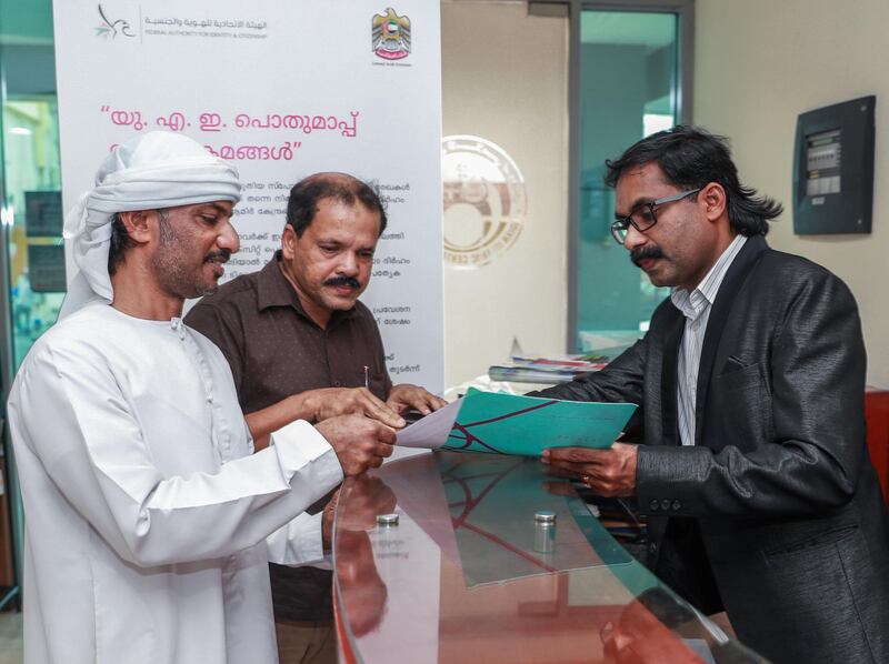 Abu Dhabi, U.A.E., July 30, 2018.  Indian Islamic Centre and KMCC Abu Dhabi secretary, Ashraf Ponnani giving out information to amnesty seekers at the centre.
Victor Besa / The National
Section:  NA
Reporter:  Anna Zacharias