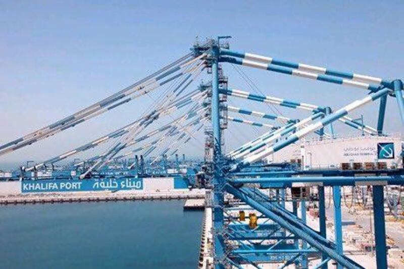 Khalifa Port is expected to have a capacity of 15 million containers by 2030. Above, ship-to-shore gantry cranes at Khalifa Port. Gabriela Maj / Bloomberg News