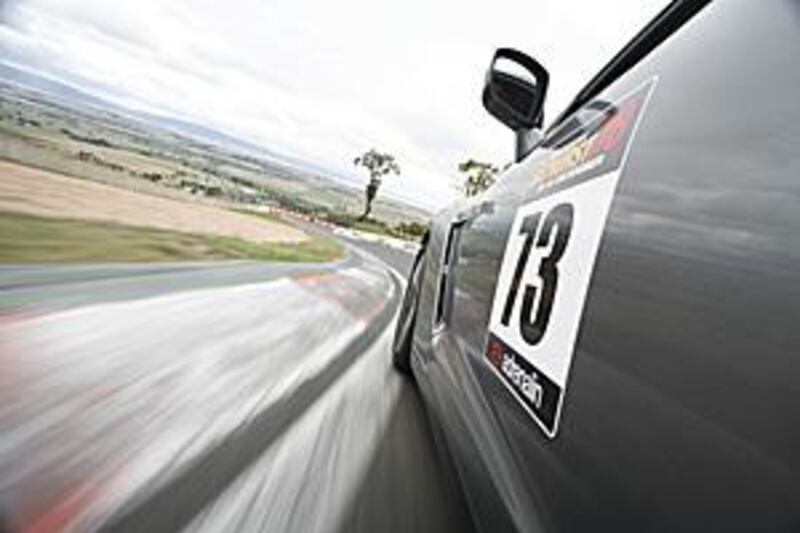 The new GT-R clears the top of Mount Panorama and heads for the descent of the Esses. doing laps.