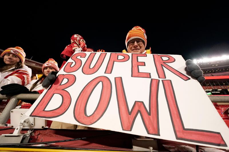 A fan holds a sign after the NFL AFC Championship playoff football game between the Kansas City Chiefs and the Cincinnati Bengals. AP Photo