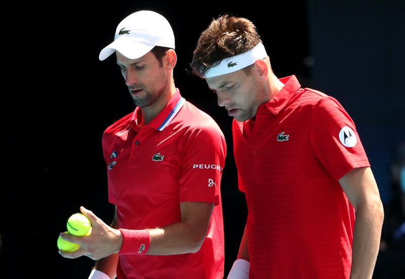 Serbia's Novak Djokovic and Filip Krajinovic during their ATP Cup group stage doubles match against Canada's Denis Shapovalov and Milos Raonic at Melbourne Park. Reuters