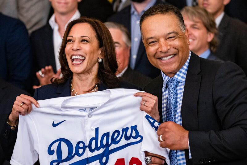 Kamala Harris holds up a jersey presented to her by Dave Roberts, team manager of the Los Angeles Dodgers, during a ceremony in the East Room of the White House in Washington on July 2, 2021, after the team won the World Series. EPA