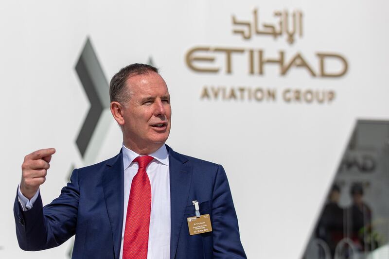 Tony Douglas, chief executive officer of Etihad Airways, speaks at their pavilion during the first day of the 16th Dubai Air Show at Dubai World Central (DWC) in Dubai, United Arab Emirates, on Sunday, Nov. 17, 2019. The Dubai Air Show is the biggest aerospace event in the Middle East, Asia and Africa and runs Nov. 17 - 21. Photographer: Christopher Pike/Bloomberg