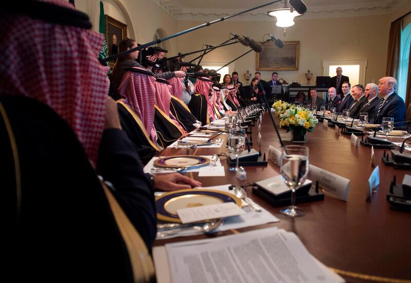 US President Donald Trump (center R) holds a lunch meeting with Saudi Arabia's Crown Prince Mohammed bin Salman (center L), and members of his delegation, in the Cabinet Room of the White House in Washington, DC, March 20, 2018. / AFP PHOTO / SAUL LOEB