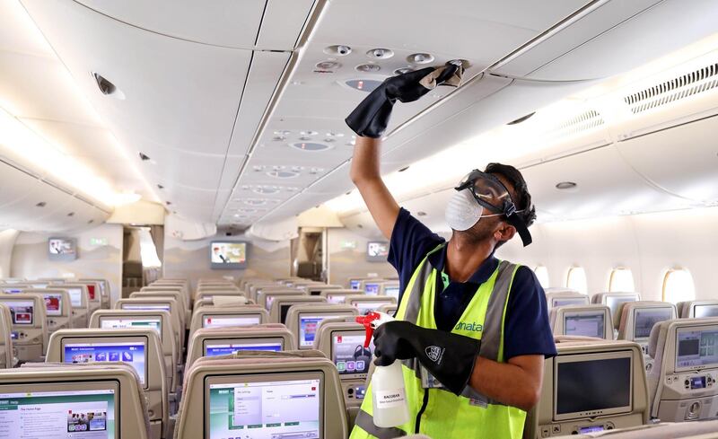 A handout image provided by Emirates airlines on March 8, 2020 in Dubai shows a member of the cleaning staff disinfecting air vents aboard an Emirates Airbus A380-800 aircraft for sterilisation efforts amidst efforts against COVID-19 coronavirus disease.  - === RESTRICTED TO EDITORIAL USE - MANDATORY CREDIT "AFP PHOTO / HO / EMIRATES" - NO MARKETING NO ADVERTISING CAMPAIGNS - DISTRIBUTED AS A SERVICE TO CLIENTS ===
 / AFP / Emirates Airlines / - / === RESTRICTED TO EDITORIAL USE - MANDATORY CREDIT "AFP PHOTO / HO / EMIRATES" - NO MARKETING NO ADVERTISING CAMPAIGNS - DISTRIBUTED AS A SERVICE TO CLIENTS ===
