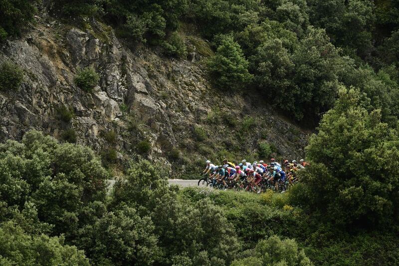 The pelaton rides in the stages of the 70th edition of the Criterium du Dauphine cycling race between Valence and Saint-Just-Saint-Rambert, southeastern France. Philippe Lopez / AFP