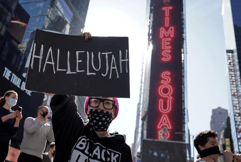 People react as media announce that Democratic candidate Joe Biden has won the 2020 US presidential election, on Times Square in New York City on November 7, 2020. Reuters