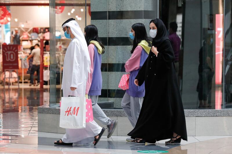 Abu Dhabi, United Arab Emirates, August 2, 2020.   
 A family goes shopping at Al Wahda Mall on the last day of Eid Al Adha. 
Victor Besa /The National
Section: NA
For:  Standalone/Stock Images