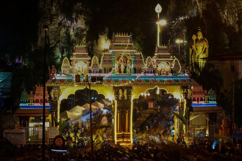 Hindu devotees walking towards the Batu Caves temple to make offerings during the Thaipusam festival in Batu Caves on the outskirts of Kuala Lumpur.  AFP