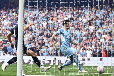 Manchester City's midfielder Ilkay Gundogan scores his team third goal against Aston Villa. AFP