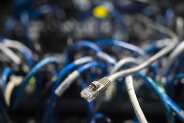 (FILES) In this file photo network cables are seen going into a server in an office building in Washington, DC on May 13, 2017. The US needs a top-level cybersecurity coordinator and a better strategy of "deterrence" to protect against hackers and other cyber threats, a congressionally mandated commission said on March 11, 2020. Defense in cyberspace requires a series of government reforms and policies to strike back at attackers, according to the report by the Cyberspace Solarium Commission. / AFP / Andrew CABALLERO-REYNOLDS