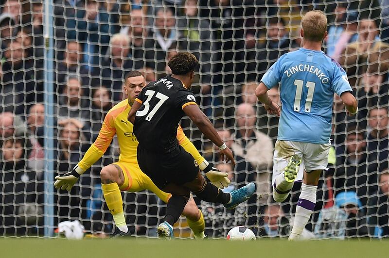 Traore scores the opening goal past Manchester City's Brazilian goalkeeper Ederson. AFP