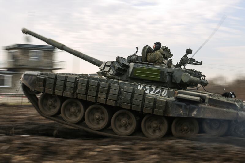 A Russian tank rolls during military drills at the Molkino training ground in the Krasnodar region on December 14. AP