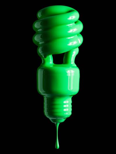 Light bulb covered in green paint. Getty Images