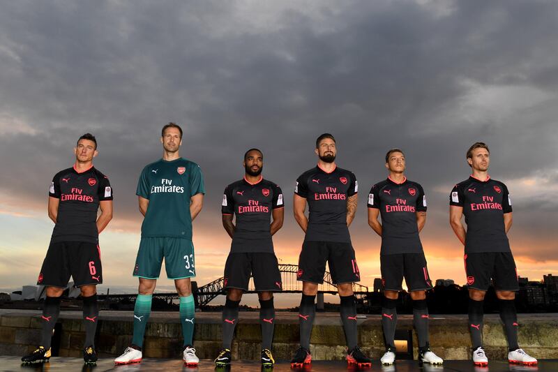 Olivier Giroud, third from right, was among the Arsenal players displaying the new third kit in Sydney, Australia as part of Arsenal's pre-season tour. Paul Miler / EPA