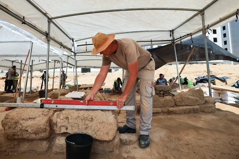 An archaeologist at the site on Saturday. AFP
