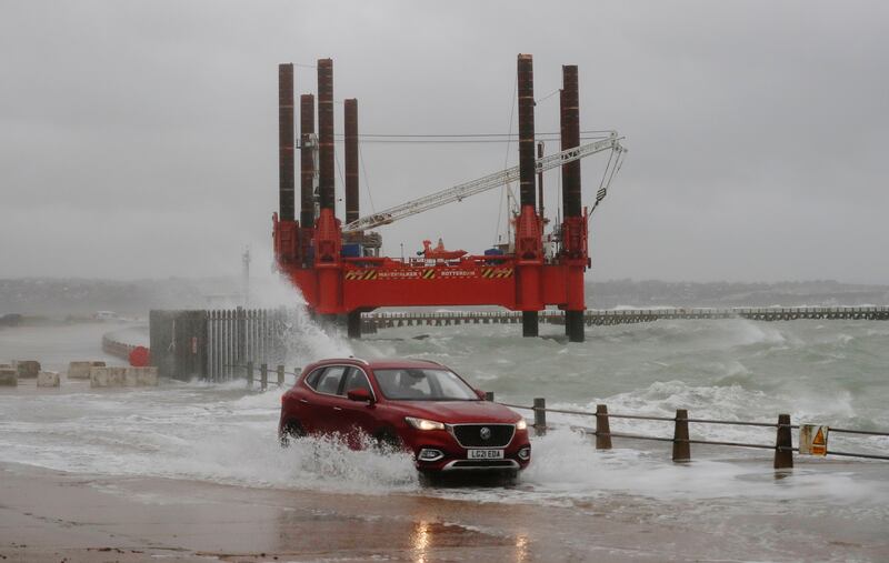 Waves hit the harbour wall in Newhaven. Reuters