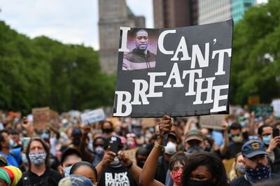 TOPSHOT - Protesters gather to demonstrate the death of George Floyd on June 4, 2020, in New York. On May 25, 2020, Floyd, a 46-year-old black man suspected of passing a counterfeit $20 bill, died in Minneapolis after Derek Chauvin, a white police officer, pressed his knee to Floyd's neck for almost nine minutes. / AFP / ANGELA WEISS
