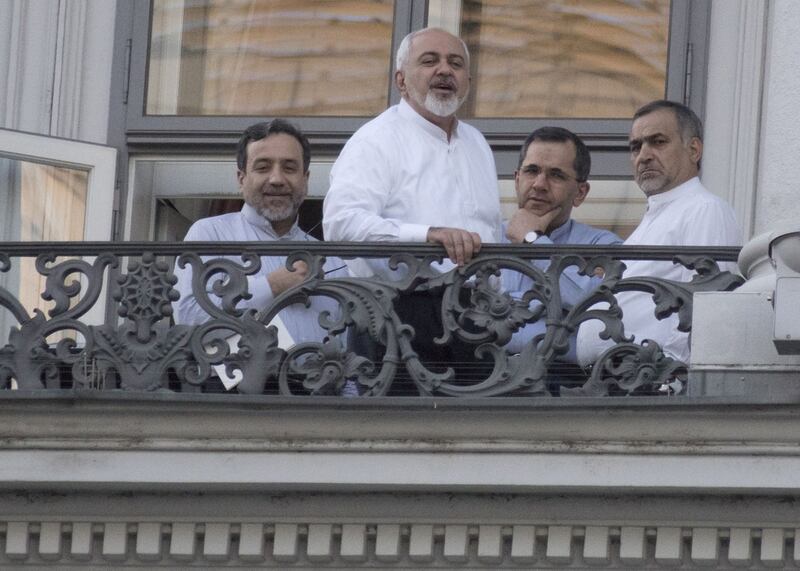 Iranian foreign minister Mohammad Javad Zarif gathers with other Iranian diplomats on a balcony at the Palais Coburg Hotel, where the Iran nuclear talks meetings are being held in Vienna. Joe Klamar / AFP 
