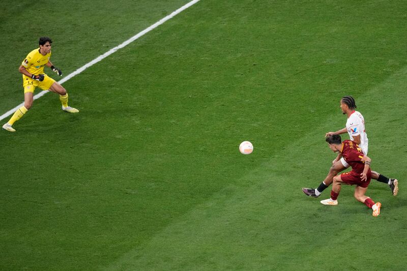 Roma's Paulo Dybala scores their opening goal. AP