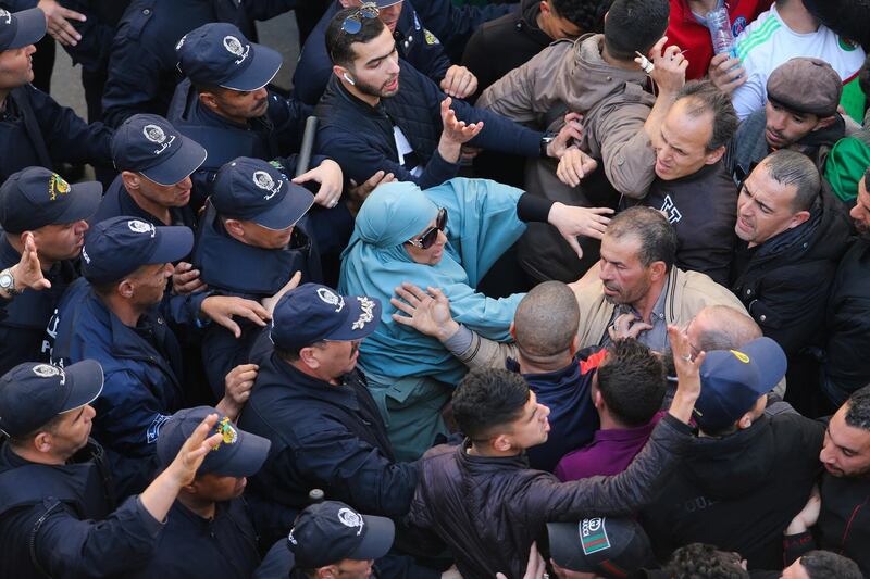 Police officers and protesters confront each other during the demostration. Reuters