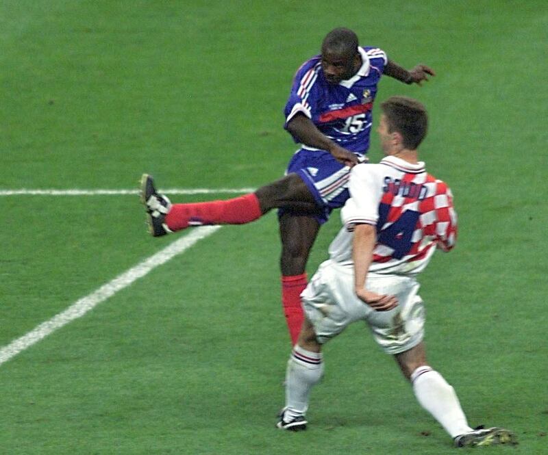 French Lilian Thuram (R) scores the second goal for his team after Croatian defender Zvonimir Soldo looks on 08 July during the 1998 Soccer World Cup semi-final clash between host France and Croatia at Stade de France in Saint-Denis, near to Paris . (ELECTRONIC IMAGE)   AFP PHOTO   PASCAL GEORGE / AFP PHOTO / PASCAL GEORGE