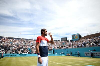 LONDON, ENGLAND - JUNE 23: Marin Cilic of Croatia takes a drink during the semi final match against Nick Kyrgios of Australia during Day six of the Fever-Tree Championships at Queens Club on June 23, 2018 in London, United Kingdom. (Photo by Patrik Lundin/Getty Images for LTA)