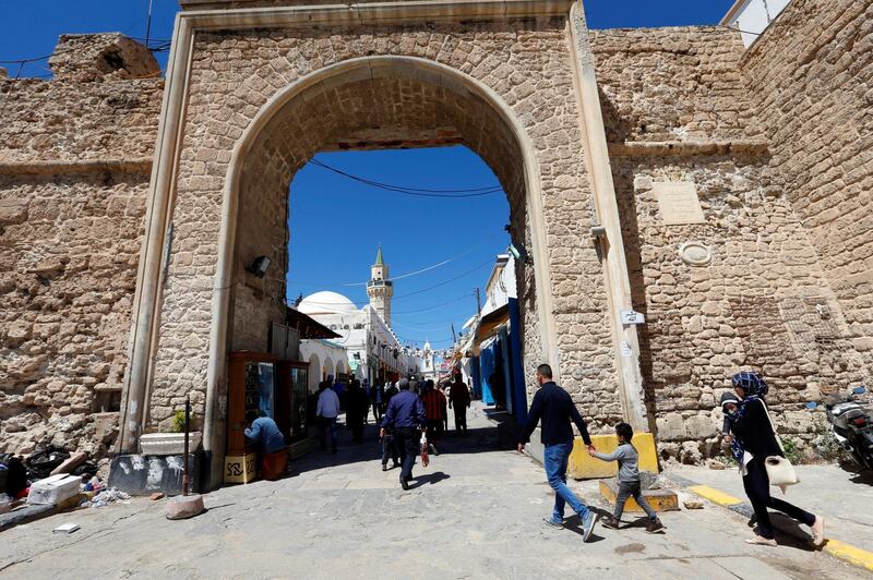 People are seen shopping at a market in the old city of Tripoli, Libya. Reuters