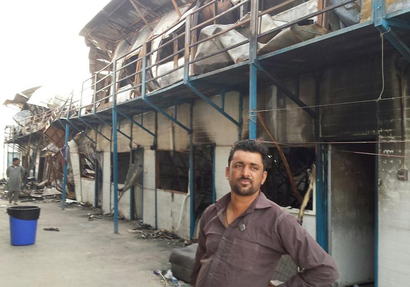 Mohammed Masood, from Pakistan, lives across from the units gutted in a fire at Al Reef Fibrex labour Camp on April 25, 2017. Mr Masood helped rescue fellow workers. Anwar Ahmad / The National