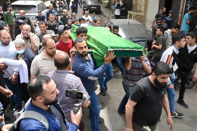 Mourners at the funeral of one of the victims. Lebanese have sought to escape their country's financial woes by trying to cross the Mediterranean to Europe. EPA