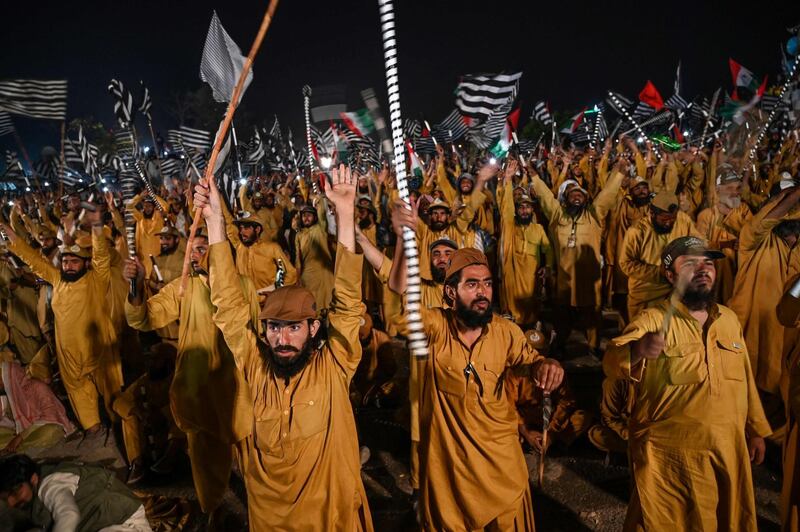 Supporters of Islamic political party Jamiat Ulema-e-Islam (JUI-F) react as they listen to the speech of their leader Maulana Fazlur Rehman during an anti-government "Azadi (Freedom) March" in Islamabad on November 1, 2019.








 Thousands of Islamists rallied in Islamabad on November 1 as several huge marches from across Pakistan converged on the capital to demand that Prime Minister Imran Khan's government step down. / AFP / Aamir QURESHI
