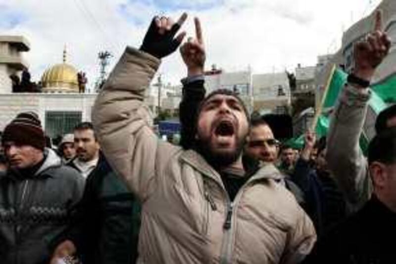 Palestinian Hamas supporters chant slogans during a protest against Israel's military operation in Gaza, in the West Bank city of Ramallah, Friday, Jan. 2, 2009. Israel showed no sign of slowing a blistering seven-day offensive against Gaza's Hamas rulers, destroying homes of more than a dozen of the group's operatives Friday and bombing one of its mosques a day after a deadly strike killed a prominent Hamas figure. (AP Photo/Nasser Shiyoukhi) *** Local Caption ***  JRL173_MIDEAST_ISRAEL_PALESTINIANS.jpg