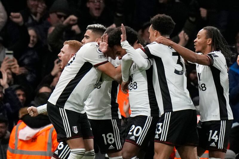 Fulham's Willian (c) celebrates with teammates after scoring the opening goal. AP