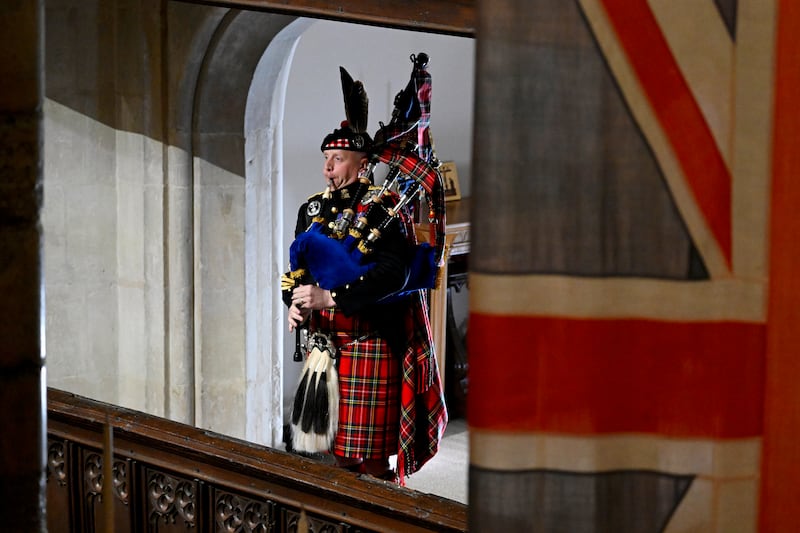 Pipe Major Paul Burns of the Royal Regiment of Scotland helps to close Queen Elizabeth II's state funeral last month. Getty Images
