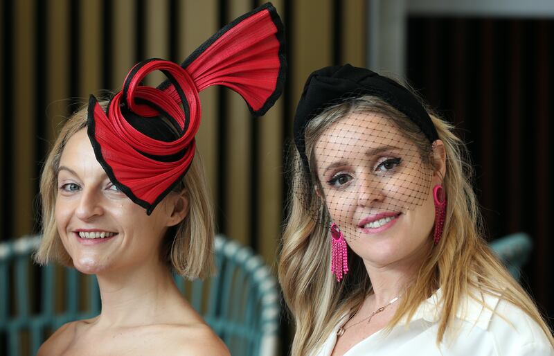 Spectators smile for the cameras at Meydan Racecourse in Dubai. Chris Whiteoak / The National