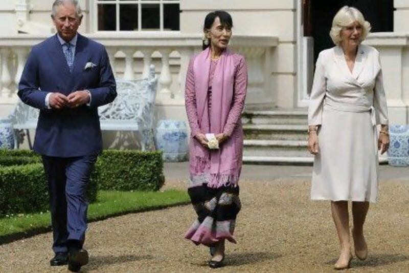Myanmar democracy icon Aung San Suu Kyi, centre, walks in the grounds of Clarence House, London with Prince Charles and Camilla, Duchess of Cornwall.