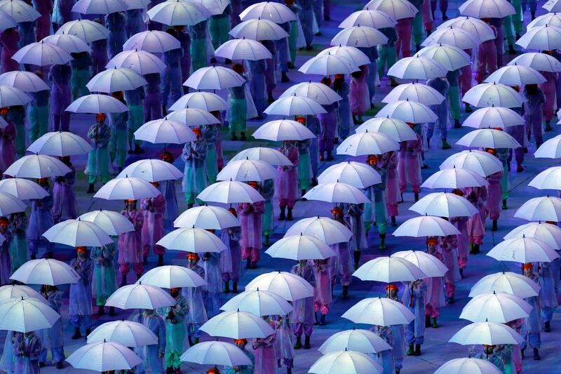Performers with umbrellas during the Opening Ceremony for the 2012 Paralympics in London, Wednesday Aug. 29, 2012. (AP Photo/Lefteris Pitarakis) *** Local Caption ***  London Paralympics Opening Ceremony.JPEG-07619.jpg