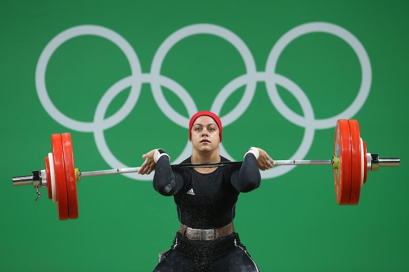 RIO DE JANEIRO, BRAZIL - AUGUST 10:  Sara Ahmed of Egypt lifts during the Women's 69kg Group A weightlifting contest on Day 5 of the Rio 2016 Olympic Games at Riocentro - Pavilion 2 on August 10, 2016 in Rio de Janeiro, Brazil.  (Photo by Julian Finney/Getty Images)