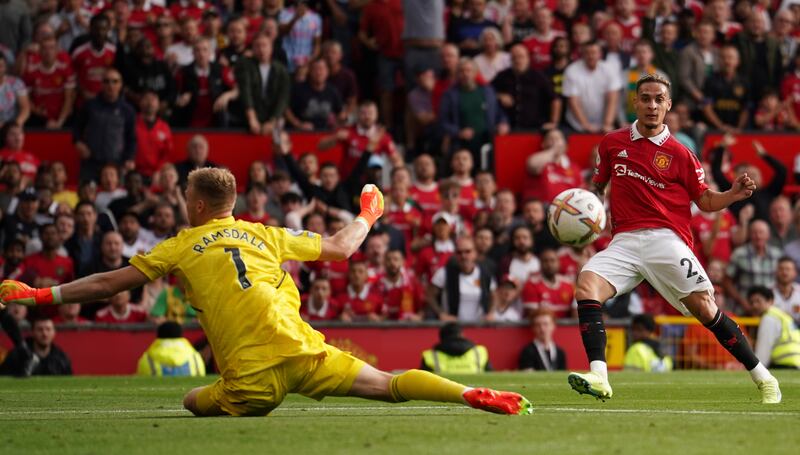 Antony finishes past Arsenal goalkeeper Aaron Ramsdale to score on his United debut. AP