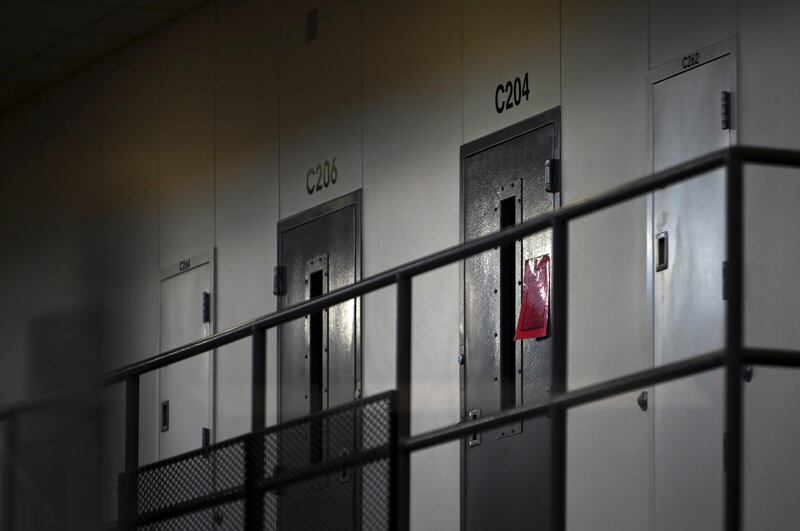 A red tag hangs on a cell door, signifying an active Covid-19 case for its inhabitants, at Faribault Prison, in Faribault, Minnesota. Aaron Lavinsky /Star Tribune via AP