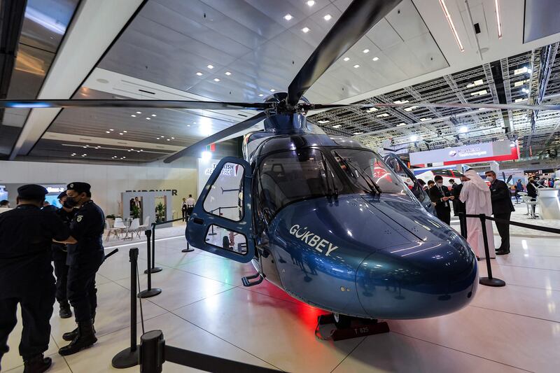 The three-day Doha International Maritime Defence Exhibition in Qatar's capital describes itself as a 'dynamic platform attended by key decision makers and industry leaders in the maritime defence and security industry'. Here a Turkish Aerospace Industries T625 Gokbey light transport utility helicopter is on display. All photos: AFP