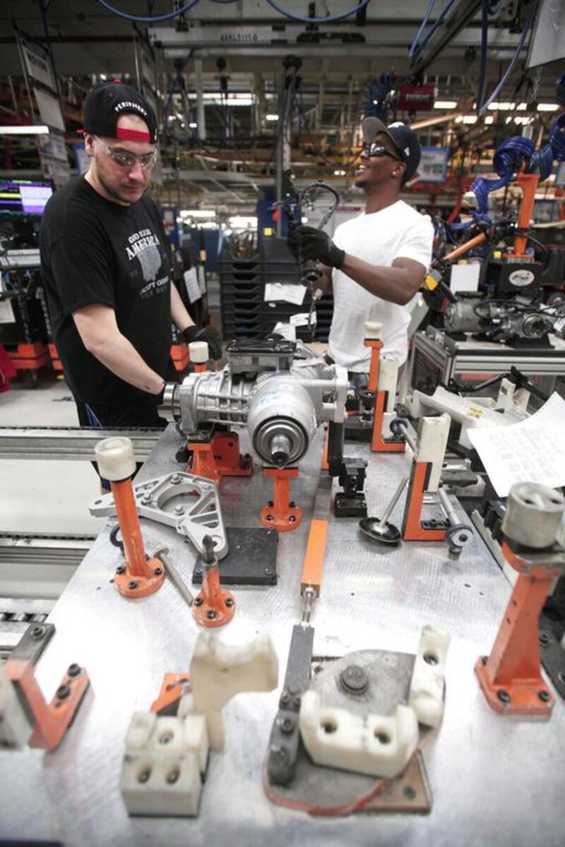 Workers prepare parts for the 2014 Jeep Cherokee at the Chrysler Toledo North Assembly Plant. Bill Pugliano / Getty Images / AFP