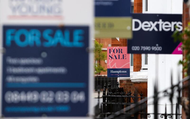 Estate agents boards outside residential properties in the Chelsea area of London, U.K., on Friday, May 21, 2021. After a year of shunning the capital amid lockdowns and coronavirus, many renters are now looking to return to urban life as restrictions ease, according to data from estate agent Hamptons International. Photographer: Chris Ratcliffe/Bloomberg via Getty Images