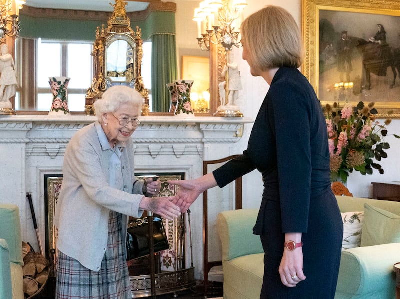 Queen Elizabeth II greets the newly elected leader of the Conservative Party, Ms Truss, at Balmoral Castle in Scotland in September. The queen invited Ms Truss to become prime minister and form a new government. Getty Images
