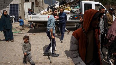 Displaced Palestinians in Rafah pack their belongings after an evacuation order by the Israeli army on Monday. AFP