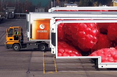 A truck pushes an articulated lorry trailer into position at the Ocado Group Plc distribution centre in Dordon, U.K., on Friday, Dec. 16, 2016. Ocado provides home delivery of a wide range of products including food and drink, toiletries and baby, household, pet care, and holiday products.  Photographer: Chris Ratcliffe/Bloomberg