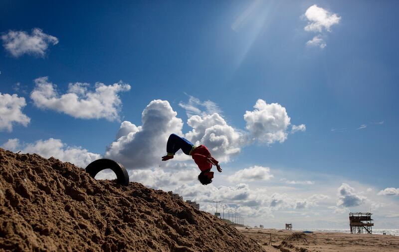 Palestinian children play on the beach of Gaza city. AP Photo